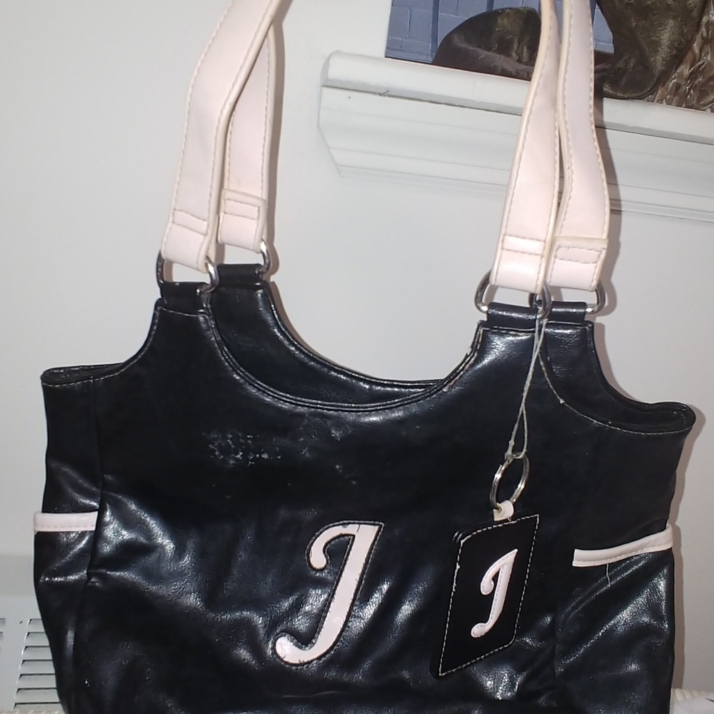 Pink and black purse with Letter J on it